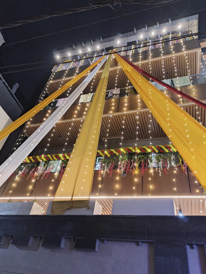 Beautiful Multi-Story Building Draping and Lighting Decor at Night